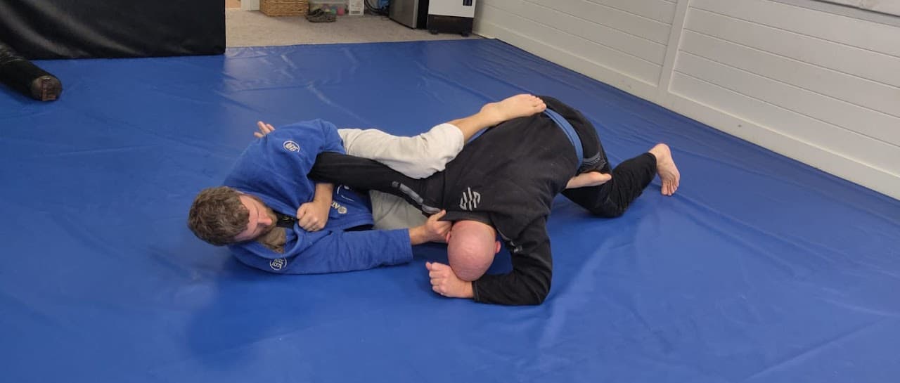 Over/Under Brazilian Jiu Jitsu logo